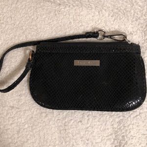 Calvin Klein wristlet is snakeskin pattern